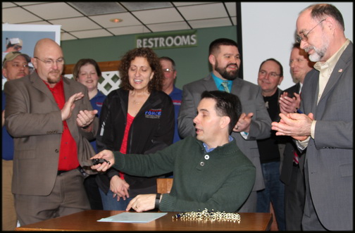 wi_signing_gov. walker.jpg